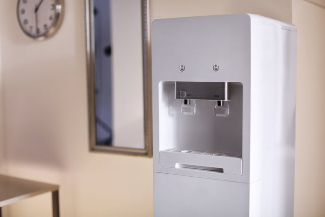 Modern bottleless water cooler in an office